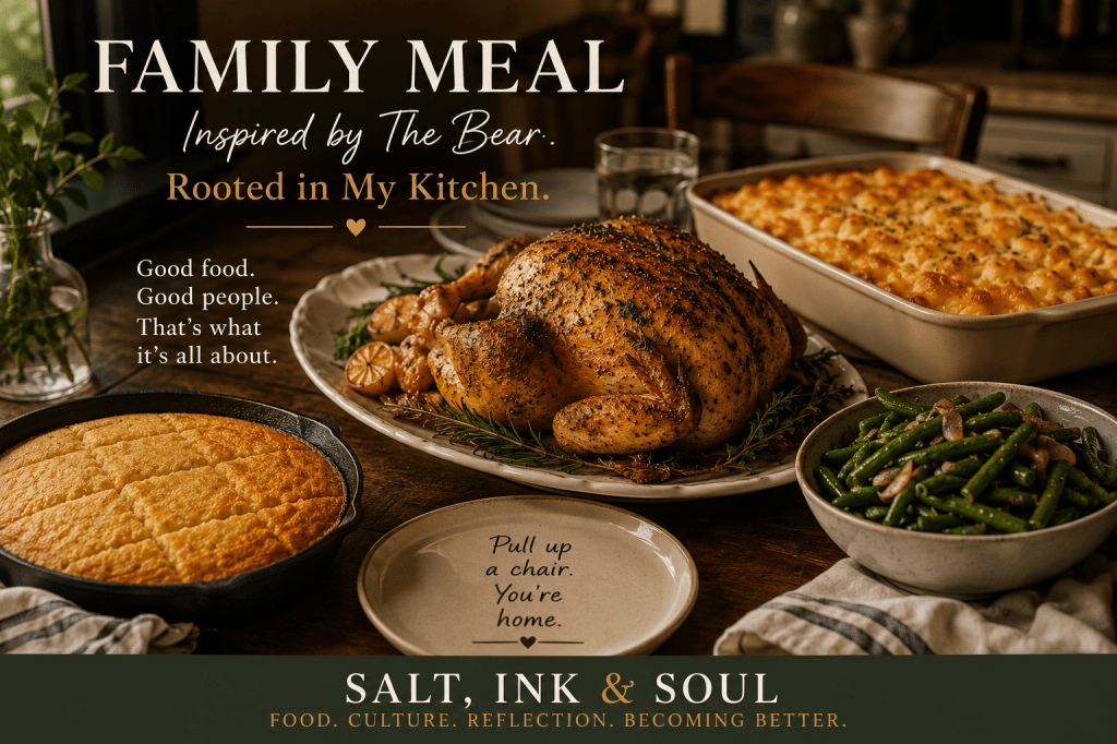 A family-style dinner featuring herb-roasted chicken, baked macaroni and cheese, seasoned green beans, cornbread, and a warmly set dining table.